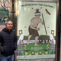 Marcelo Potosi stands on Market Street next to his Revitalizing the Culture poster for the series titled The Future of the Ramaytush Ohlone